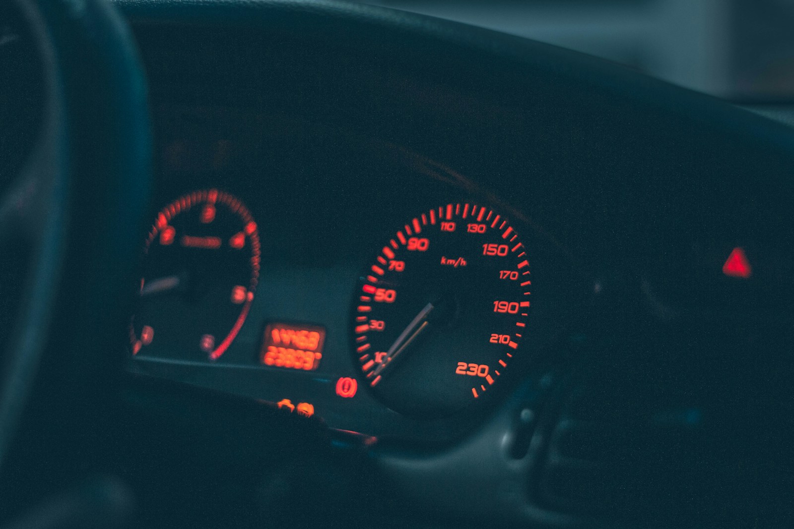 the dashboard of a car with red and white lights, sr-22