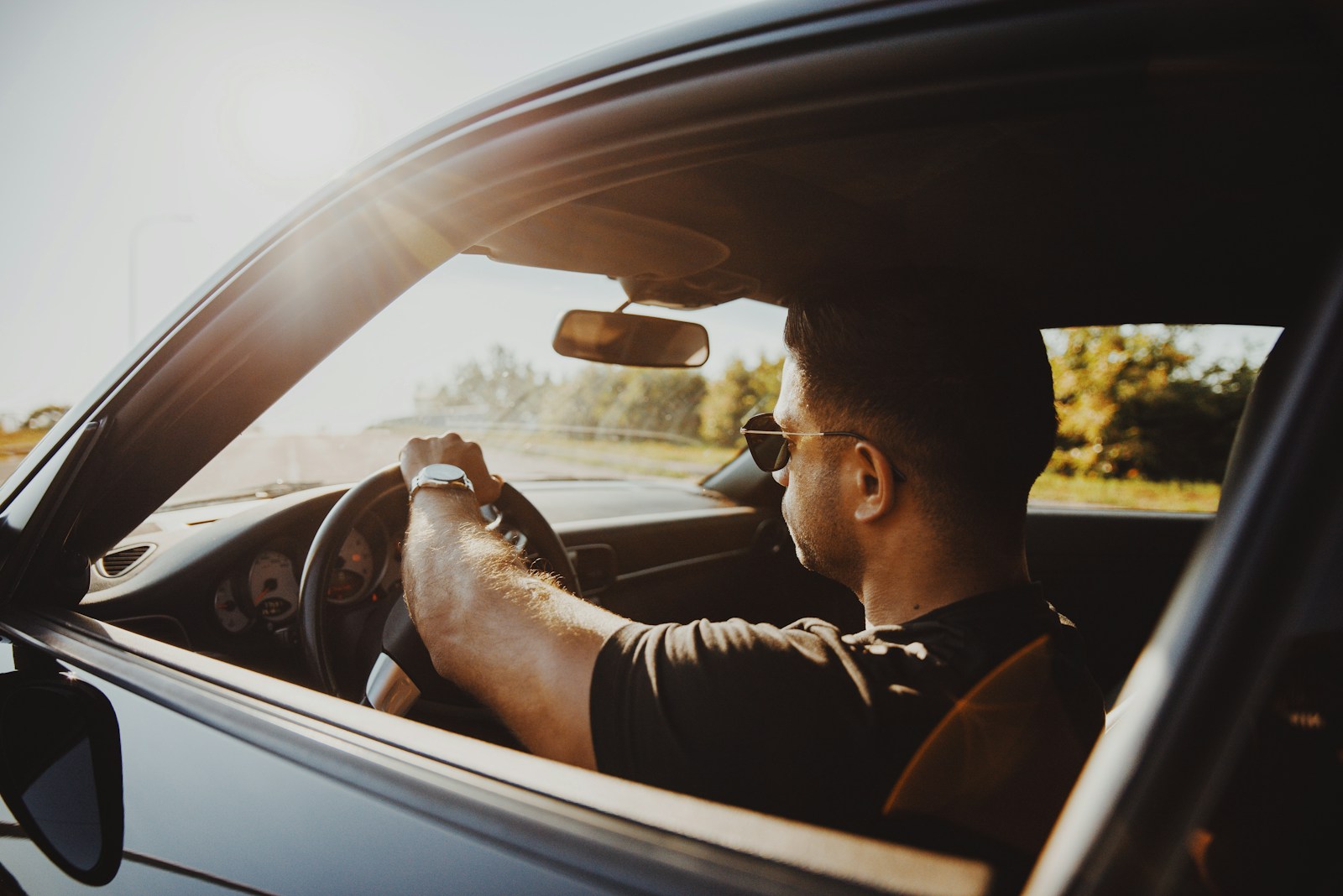 man in black jacket driving car during daytime, SR-22